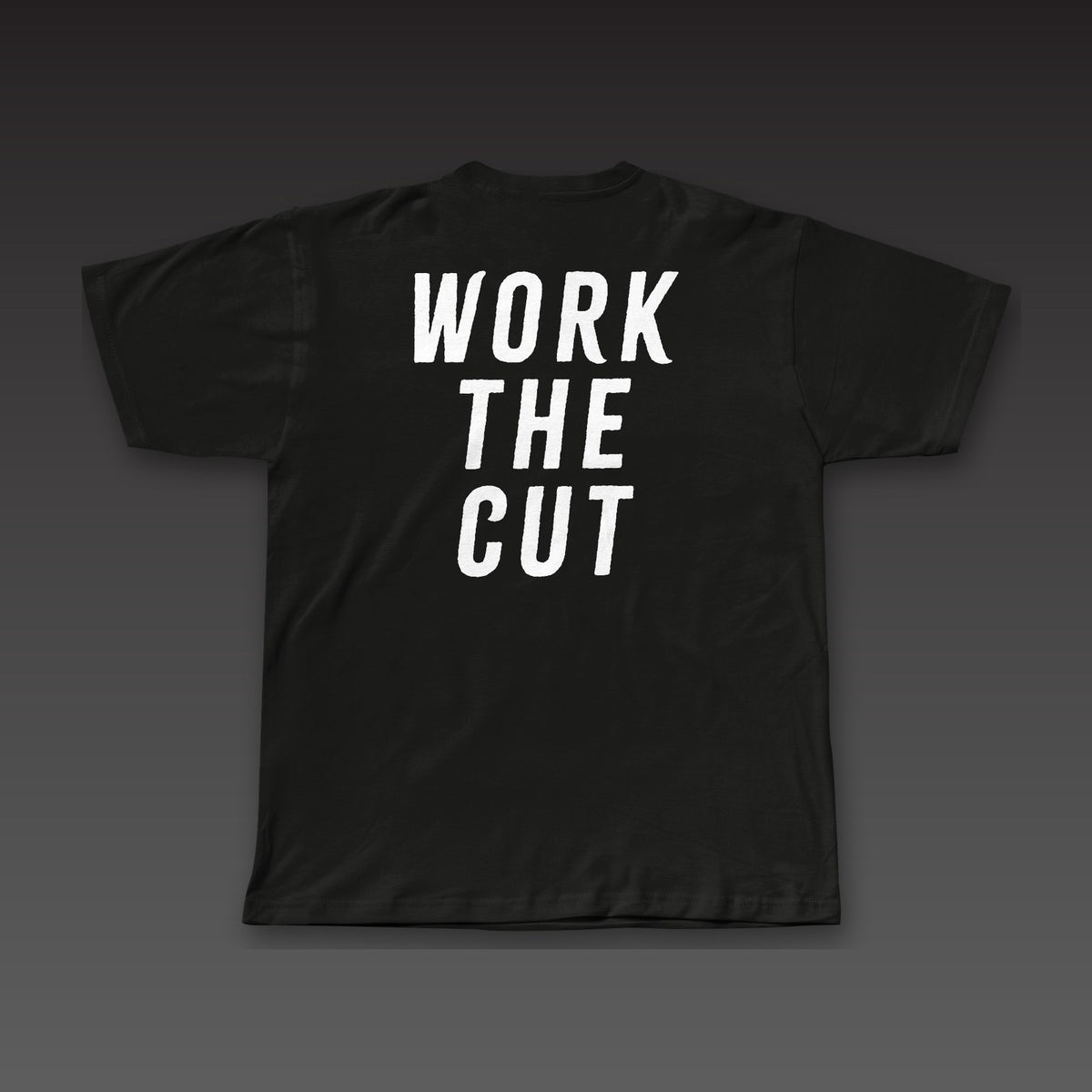 Fist Pocket Tee in black, Work the Cut stacked across the back