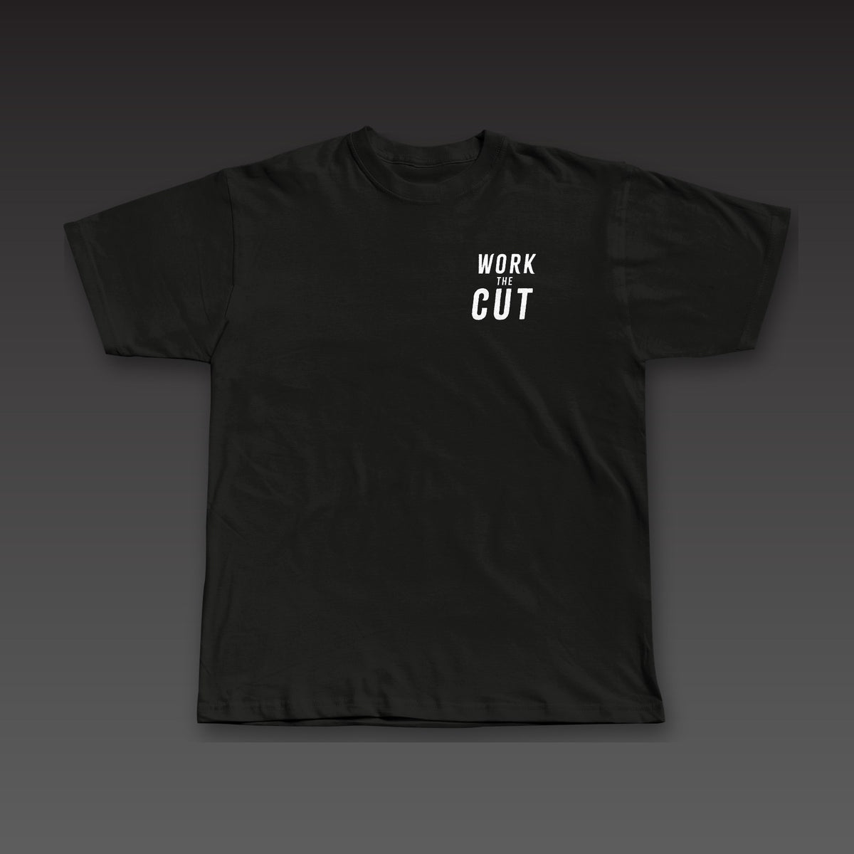 Spine Tee in black, Work the Cut stacked on the left chest