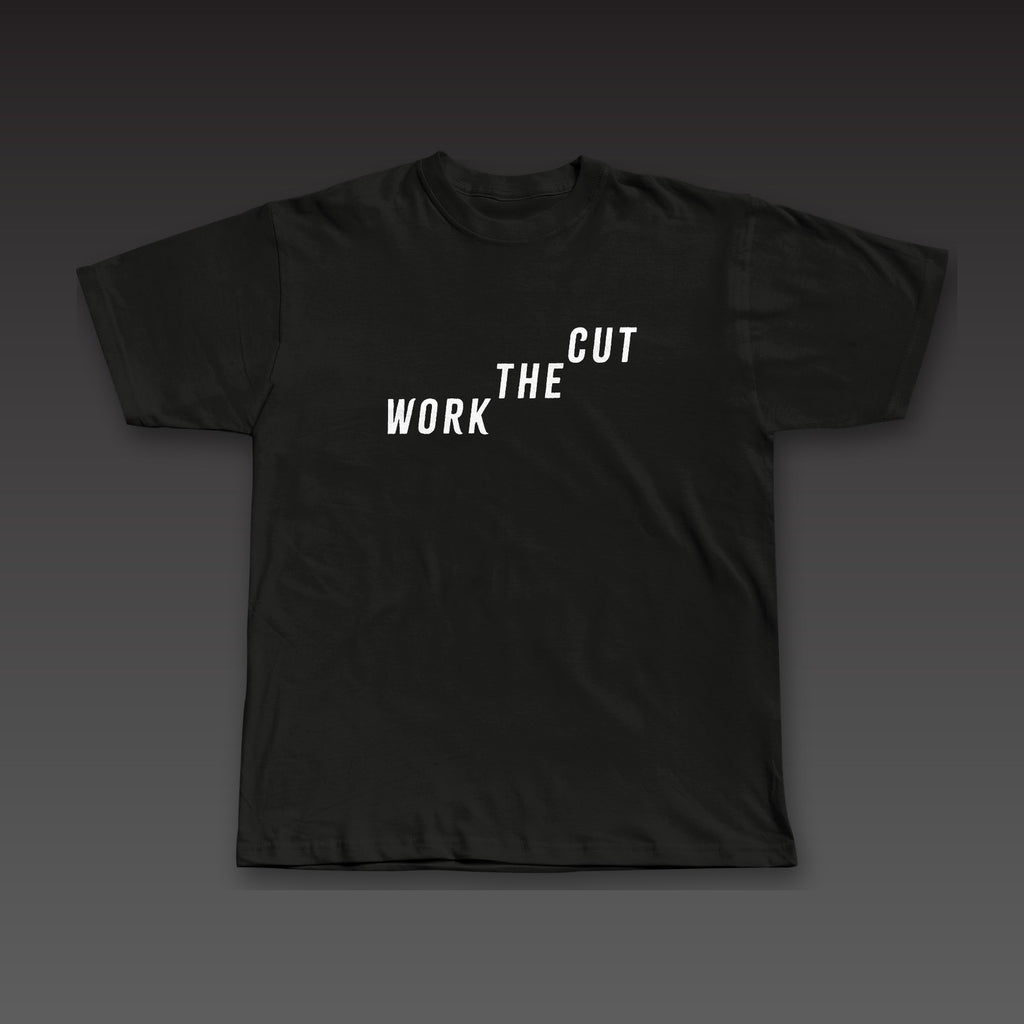 The Climb Tee in black, Work the Cut climbing up across the chest