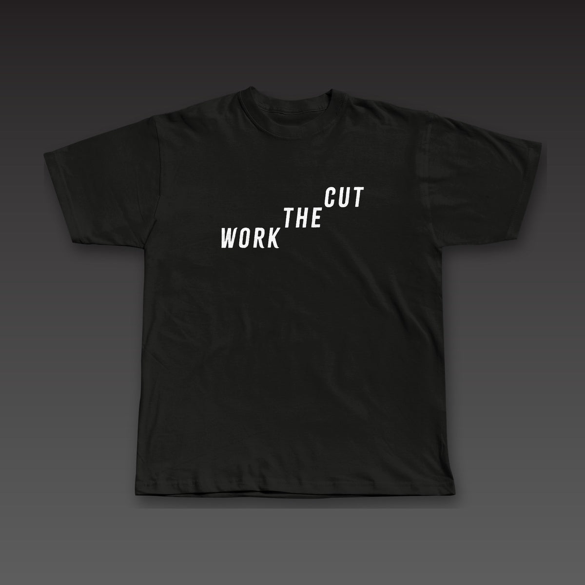 The Climb Tee in black, Work the Cut climbing up across the chest